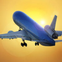 Airplane taking off into the sun