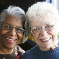 Two older ladies smiling