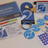 Hearing Link personal awareness kit with badges, stickers and cards