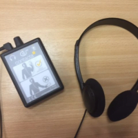 loop listener device with headphones