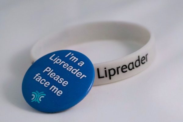 Lipreader wristband and badge