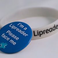 Lipreading badge and wristnband