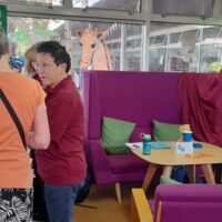 Peer support volunteer discussing hearing loss issues