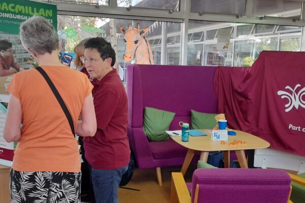 Peer support volunteer discussing hearing loss issues