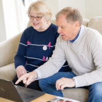 Two people accessing a Helpful Hour webinar session.